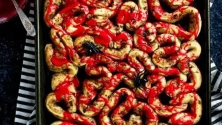 Halloween-themed bloody guts cinnamon rolls served on a spooky plate