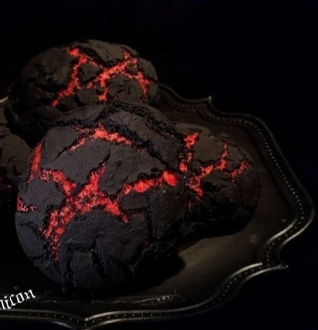 Sliced Halloween Brimstone Bread with eerie decorations for a festive celebration