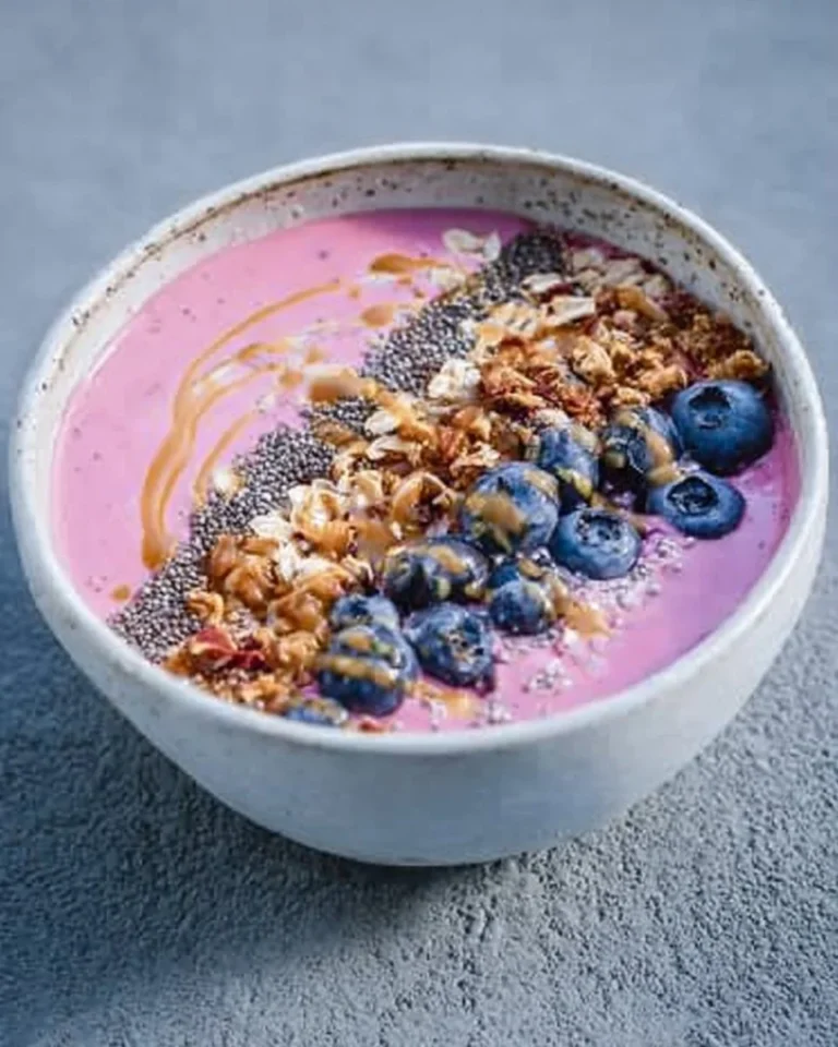 Berry, Coconut & Chia Smoothie Bowl topped with fresh fruits and seeds