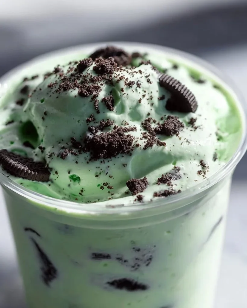 Delicious copycat Oreo Shamrock McFlurry topped with whipped cream and Oreos.