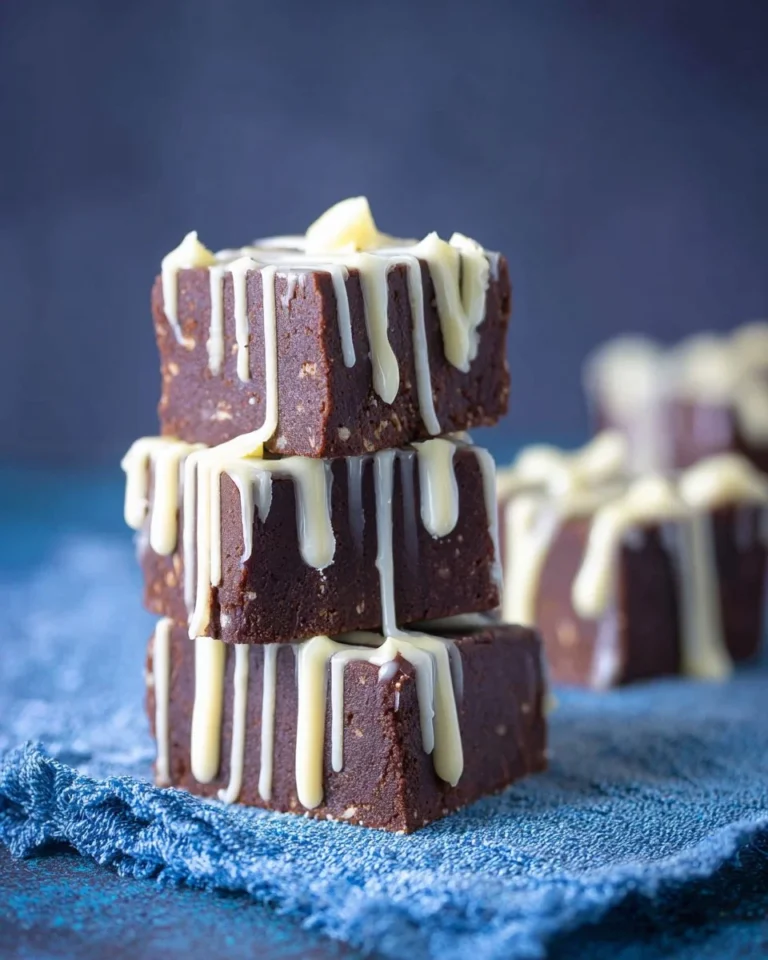 Delicious Kahlua Cream Fudge on a plate with coffee beans